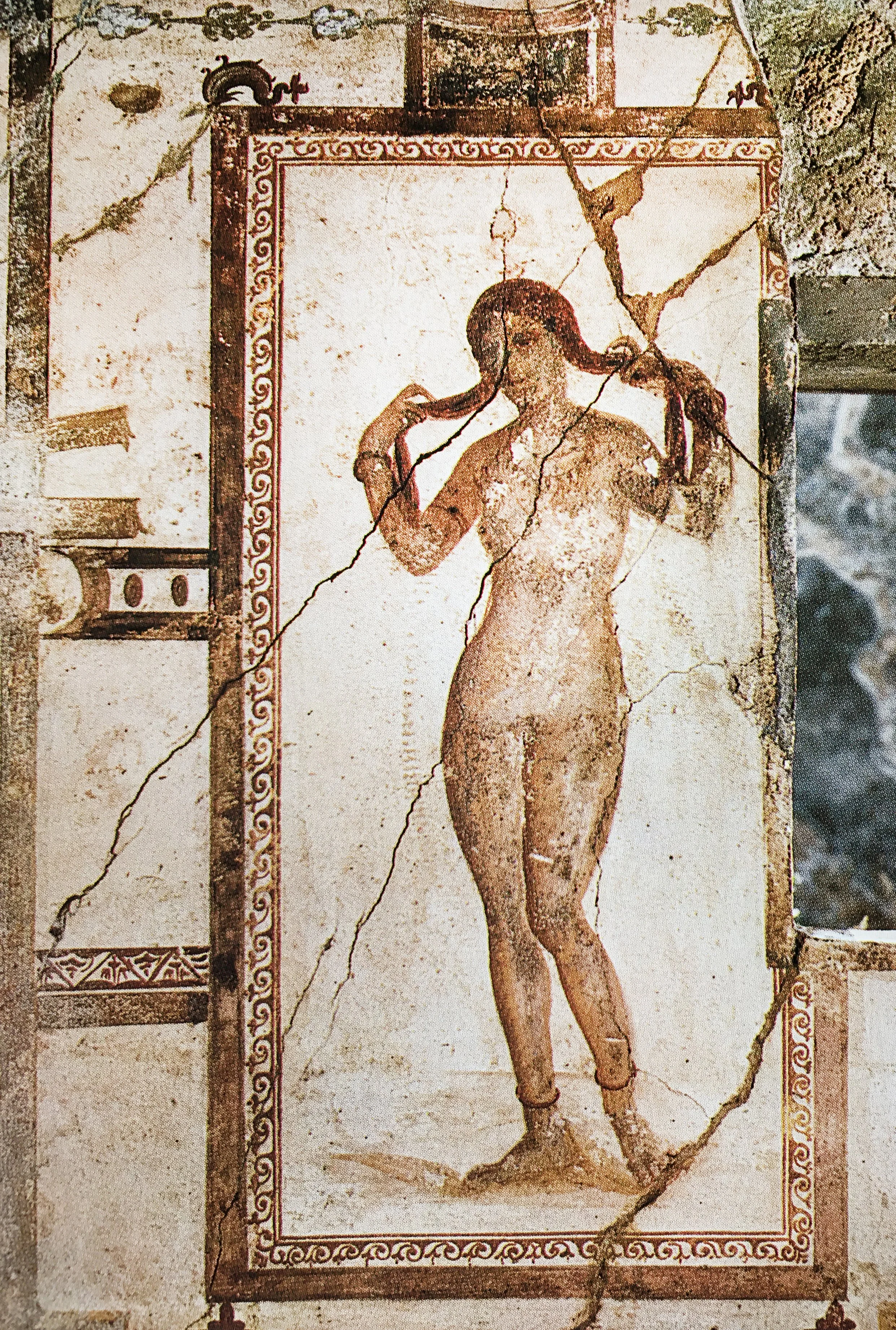 A fresco of Venus wringing her hair in the House of the Prince of Naples in Pompeii.